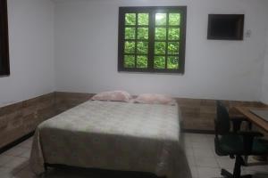 Postel nebo postele na pokoji v ubytování Quarto em casa na Mata Atlântica