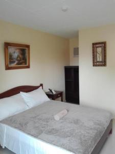 Postel nebo postele na pokoji v ubytování Dino Residences