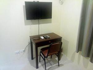 TV a/nebo společenská místnost v ubytování Dino Residences
