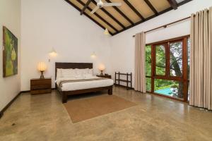 Ένα ή περισσότερα κρεβάτια σε δωμάτιο στο Roman Lake Ayurveda Boutique Resort +71 φωτογραφίες