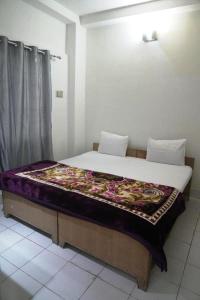 Postel nebo postele na pokoji v ubytování Rainbow Inn