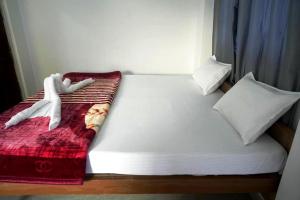 Postel nebo postele na pokoji v ubytování Rainbow Inn