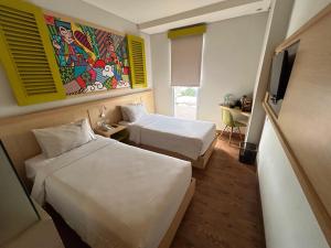 MaxoneHotels.com at Kramat tesisinde bir odada yatak veya yataklar