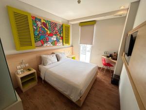 MaxoneHotels.com at Kramat tesisinde bir odada yatak veya yataklar