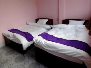 Postel nebo postele na pokoji v ubytování Halong Happy Hostel
