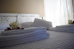 A bed or beds in a room at Casale Dolci Dimore