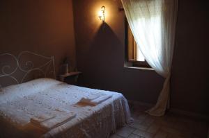 A bed or beds in a room at Casale Dolci Dimore