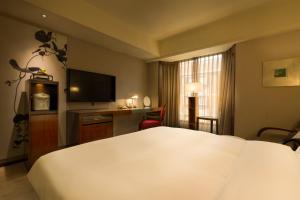 Voodi või voodid majutusasutuse Les Suites Taipei - Da An toas