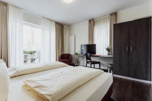 Postel nebo postele na pokoji v ubytování Hotel Bloemfontein