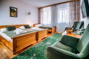 Ένα ή περισσότερα κρεβάτια σε δωμάτιο στο Wellness Penzion Zora Family +126 φωτογραφίες