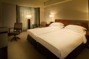 Voodi või voodid majutusasutuse Les Suites Taipei - Da An toas