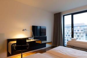 TV a/nebo společenská místnost v ubytování Scandic Berlin Potsdamer Platz