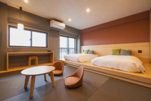 Voodi või voodid majutusasutuse 奥州平泉温泉旅館 itsumu toas