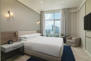 Postel nebo postele na pokoji v ubytování Hyatt Centric Santo Domingo + 37 fotografií
