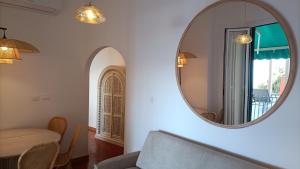 a living room with a mirror and a couch at Sea view apartment VIVIANA in Monterosso al Mare