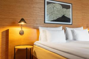 A bed or beds in a room at Hyatt Place Gothenburg Central