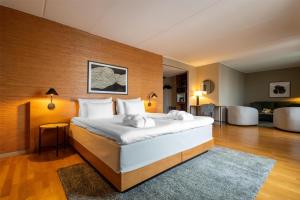 A bed or beds in a room at Hyatt Place Gothenburg Central
