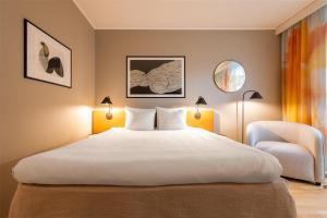 A bed or beds in a room at Hyatt Place Gothenburg Central