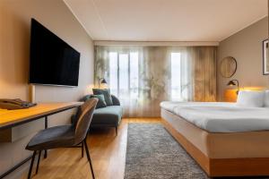 A bed or beds in a room at Hyatt Place Gothenburg Central