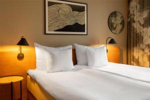 A bed or beds in a room at Hyatt Place Gothenburg Central