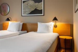A bed or beds in a room at Hyatt Place Gothenburg Central