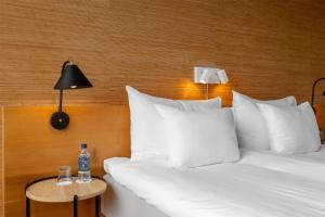 A bed or beds in a room at Hyatt Place Gothenburg Central