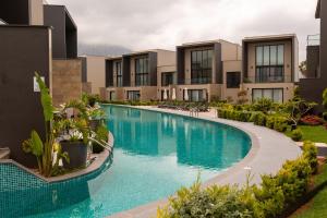an image of a swimming pool at a resort at Kervansaray Two Bed Apartment by HolidayKeys in Kyrenia