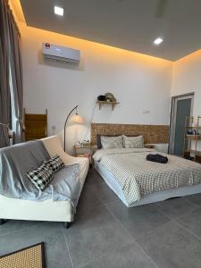 a bedroom with two beds and a air conditioner on the wall at Casa Boheme Empire Damansara in Petaling Jaya +10 photos