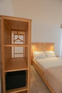 Postel nebo postele na pokoji v ubytování Nona's Rooms