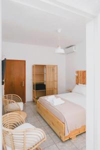 Postel nebo postele na pokoji v ubytování Nona's Rooms