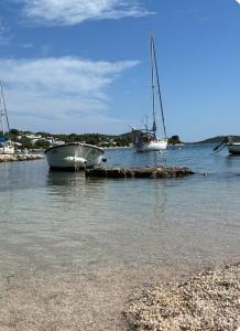 two boats are docked in a body of water at Mobile home sunshine in Drage +2 photos