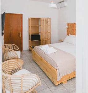 Postel nebo postele na pokoji v ubytování Nona's Rooms
