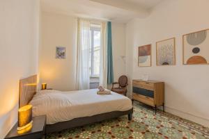 Posteľ alebo postele v izbe v ubytovaní Maison de Vacances 8 à 15 pers à proximité du Canal du Midi + 37 fotografií