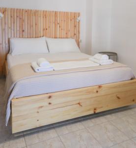 Postel nebo postele na pokoji v ubytování Nona's Rooms