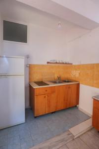 Kuchyň nebo kuchyňský kout v ubytování Nona's Rooms