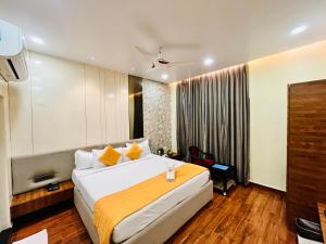 Letto o letti in una camera di Shankar Bhavan By Vinayak Hotels