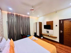TV o dispositivi per l'intrattenimento presso Shankar Bhavan By Vinayak Hotels
