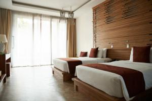 Postel nebo postele na pokoji v ubytování EL DE Olive Aero Suites Near Delhi Airport