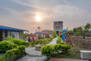 Laste mänguala majutusasutuses Jim & Holmes Resort & Luxury Residences in Jim Corbett National Park