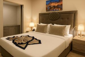 Una cama o camas en una habitación de Saraya Palace Hotel
