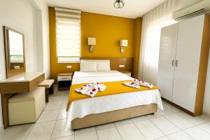 Postel nebo postele na pokoji v ubytování Nature Hotel Doğa Hotel Ölüdeniz
