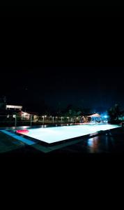 a skate park lit up at night with at Paradise Farm Alibaug in Kashid +44 photos