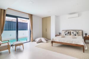 a bedroom with a bed and a large window at Presidential Suite 350m2 Bellavista on one level,Private SPA&HEATED POOL in Adeje +25 photos