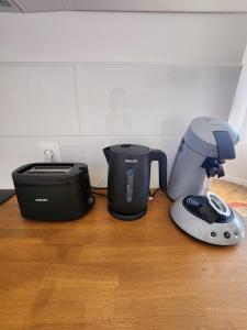 a coffee maker and a blender on a table at Studio Terre - 1st floor - City center - Train station 5 minutes away in Charleville-Mézières