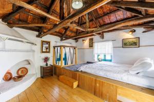 Postel nebo postele na pokoji v ubytování Anatoli Peak Cottage