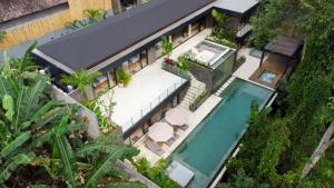 an overhead view of a house with a swimming pool at Villa Red Wine by BaliSuperHost in Ubud