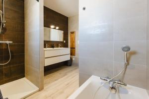 a bathroom with a shower and a sink at La Villa Pop & Steel - maison avec 4 chambres in Orgères +18 photos