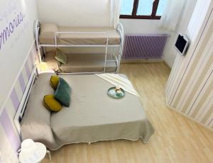 Кровать или кровати в номере Holihome Le Rose