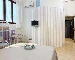 Телевизор и/или развлекательный центр в Holihome Le Rose +6 фотографий