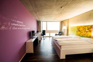 Ένα ή περισσότερα κρεβάτια σε δωμάτιο στο HOTEL APART - Welcoming l Urban Feel l Design
